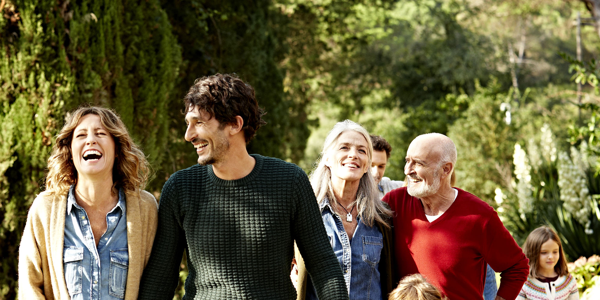 Family walking outside in the sun